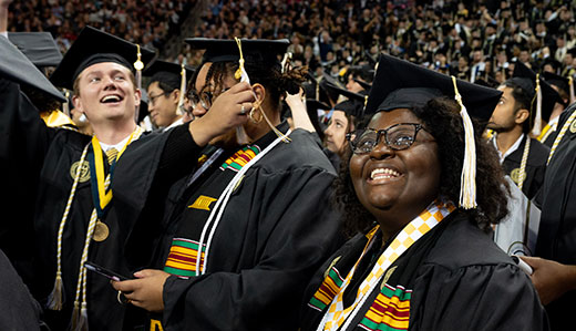 Undergraduate students celebrate getting their degrees at Georgia Tech’s Commencement Ceremony.