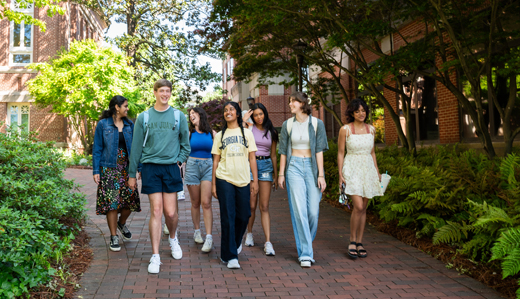 A group of undergraduate students walks outside of the student success center on Georgia Tech’s campus.